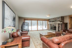 Family Room with Stone Fireplace - Country homes for sale and luxury real estate including horse farms and property in the Caledon and King City areas near Toronto
