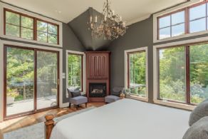 Master bedroom with amazing views and fireplace - Country homes for sale and luxury real estate including horse farms and property in the Caledon and King City areas near Toronto