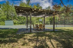 Tennis court with seating area - Country homes for sale and luxury real estate including horse farms and property in the Caledon and King City areas near Toronto