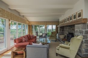 Family room with walk-out to deck - Country homes for sale and luxury real estate including horse farms and property in the Caledon and King City areas near Toronto