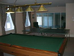 Games Room - This large recreation room can easily accommodate a billiards table and a ping pong table - Country homes for sale and luxury real estate including horse farms and property in the Caledon and King City areas near Toronto