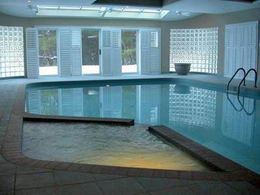 Indoor Pool - Todd gunite pool with extensive decking, casual sitting area and a full wet bar. Custom beamed ceiling;  Walk-out to the grounds - Country homes for sale and luxury real estate including horse farms and property in the Caledon and King City areas near Toronto
